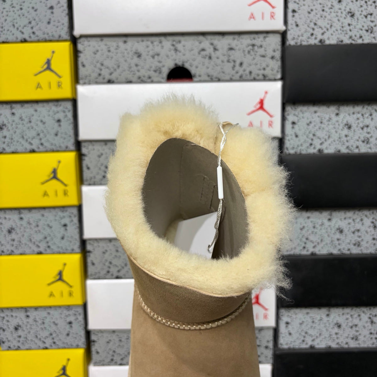 UGG Mini Bailey Bow Ankle Boot – Suede Boot with Cream Shearling Lining, Satin Bow Detail & Sand Sugar Sole in Sand