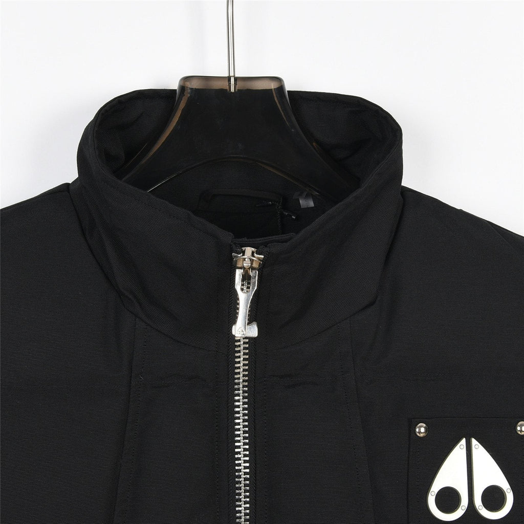Moose Knuckles Puffer Vest in Black with Metallic Logo and Stud Details