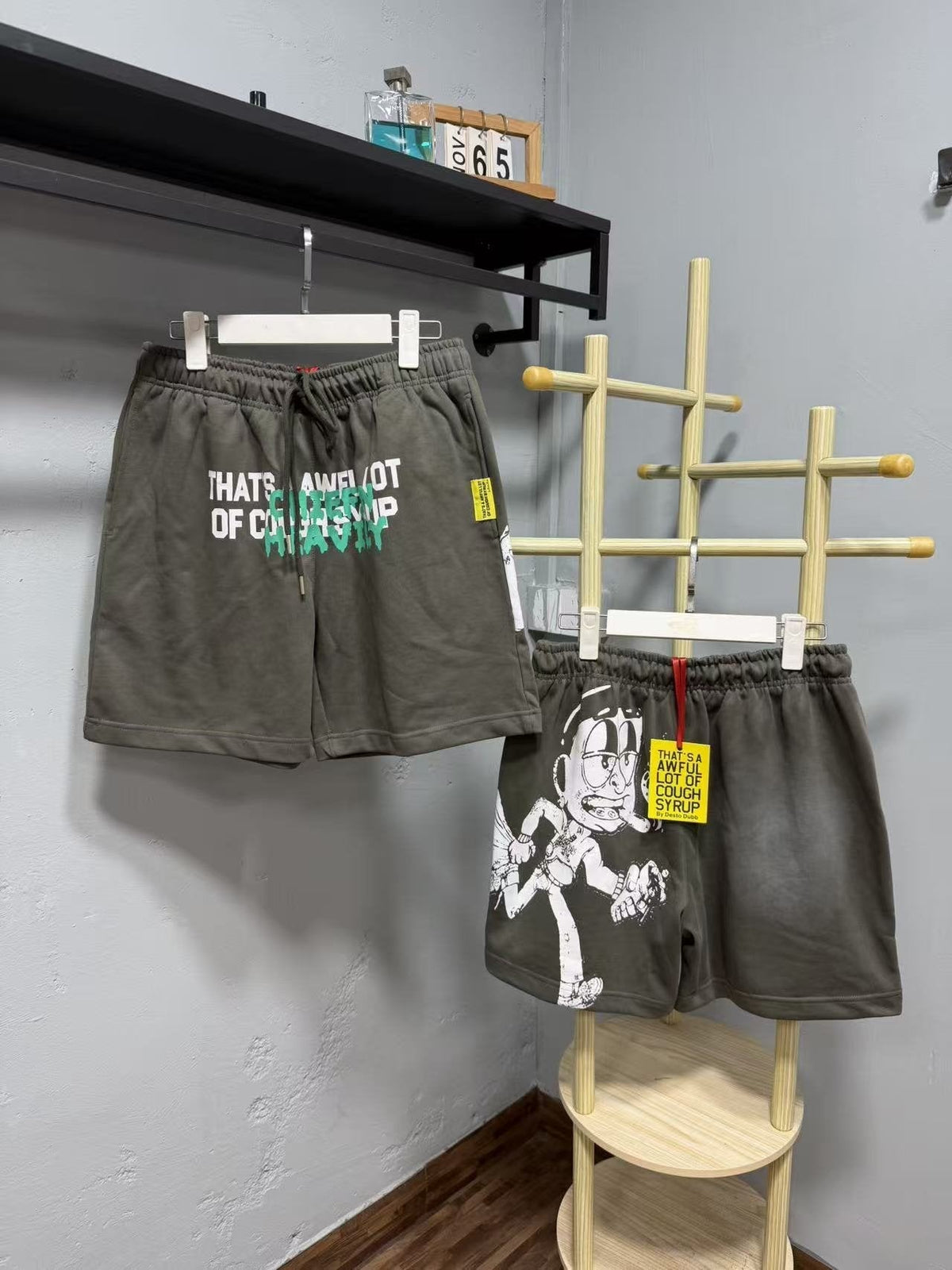 THAT'S A AWFUL LOT OF COUGH SYRUP Cartoon Back Graphic Shorts